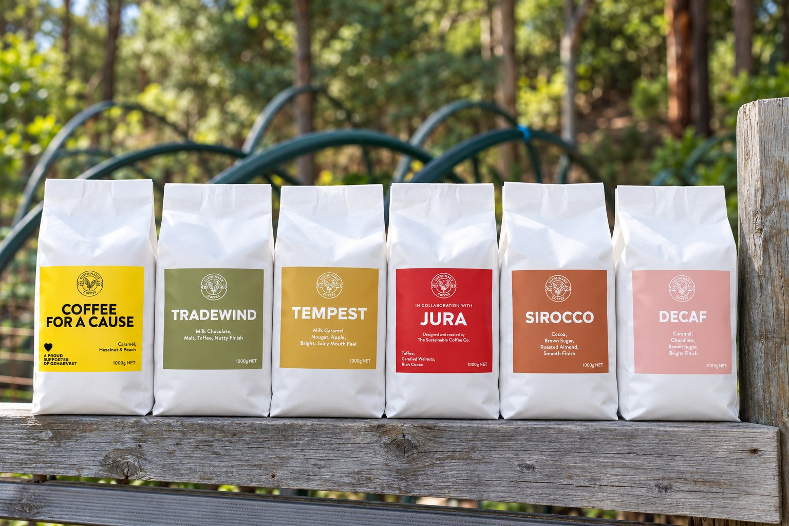 The six coffees in white bags on a timber fence